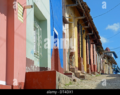 Street of brightly painted houses, Trinidad, Cuba Stock Photo