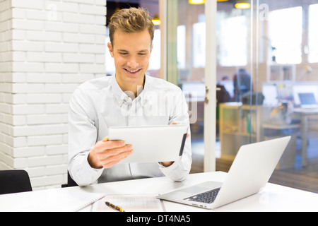 Man business tablet pc desk laptop message e-mail Stock Photo