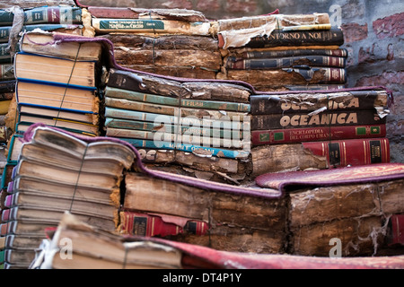 piles of many old italian books in second-hand bookseller shop Stock Photo