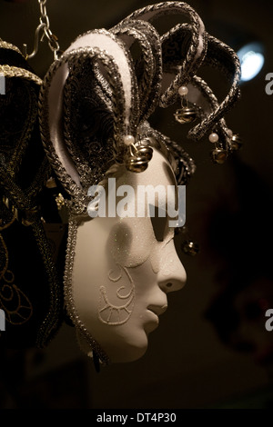 Venetian carnival mask in profile closeup on dark background Stock Photo