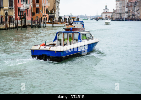 Venice, Italy. Police boat of the local police of Venice patrols on the Grand Canal (Canal Grande). Stock Photo