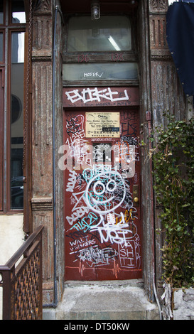 Graffiti marked apartment building walkup on the lower east side of Manhattan, NYC.
