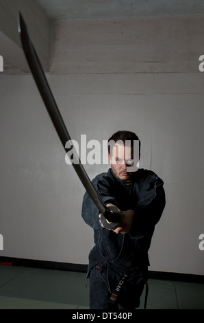 Man practicing martial arts Bujinkan, also known as Ninjitsu, England Stock Photo