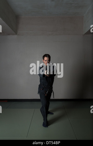 Man practicing martial arts Bujinkan, also known as Ninjitsu, England Stock Photo