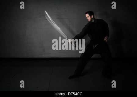 Man practicing martial arts Bujinkan, also known as Ninjitsu, England Stock Photo