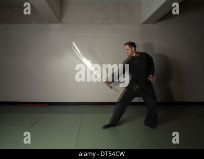 Man practicing martial arts Bujinkan, also known as Ninjitsu, England Stock Photo