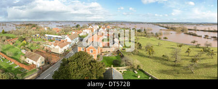 East Lyng, Somerset, UK. 9th Feb, 2014. Heavy flooding in the village of East Lyng on the Somerset Levels taken 9th February 2014. This panorama taken from the top of St. Bartholomew's church shows the village nearly surrounded by water. The A361 remains closed towards Burrowbridge and a severe flood alert remains in the area where there is a danger to life. Water is rising rapidly in the East of the village and has started to flood some houses. Some residents have been asked to evacuate but have decided to stay. This is the worst flood on the Somerset Levels in living history. Stock Photo