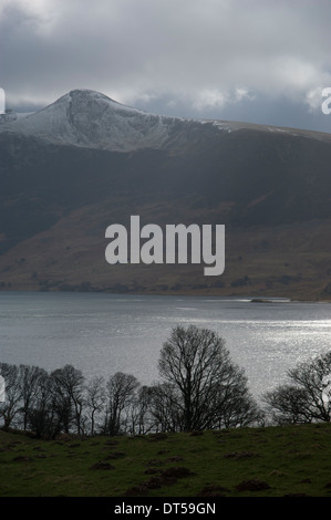 Red Pike, from across Crummock Water, Lake District, Cumbria, England. The shot is taken on a cloudy but sunny day. Stock Photo