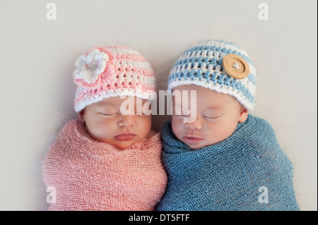 Boy and girl fraternal twin newborn babies Stock Photo