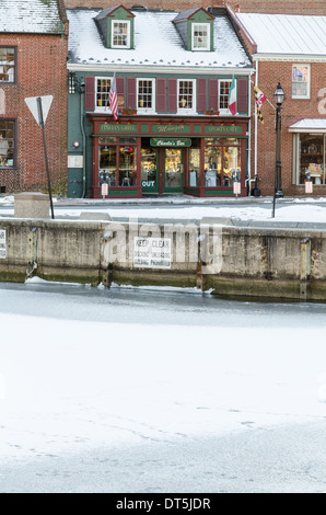 The stores along the dock front in Annapolis during winter with the harbor frozen over Stock Photo