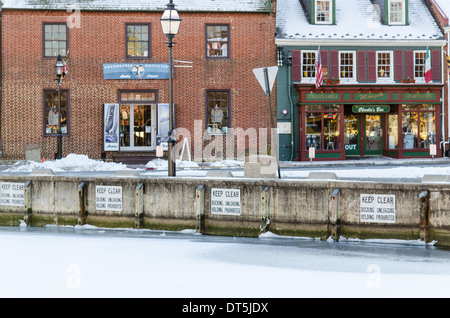 The stores along the dock front in Annapolis during winter with the harbor frozen over Stock Photo
