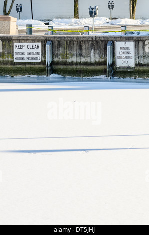Annapolis dock covered in snow and ice during the polar vortex in January 2014 Stock Photo