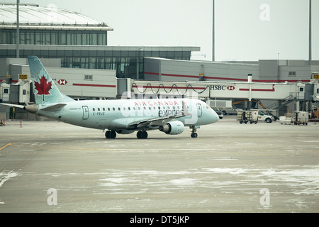 Air Canada Express Embraer 175 Jet on tarmac at Pearson International Airport Stock Photo