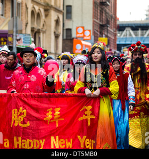 Chinese Americans dressed in traditional costumes parade at the Lunar New Year Festival in Chinatown. Stock Photo