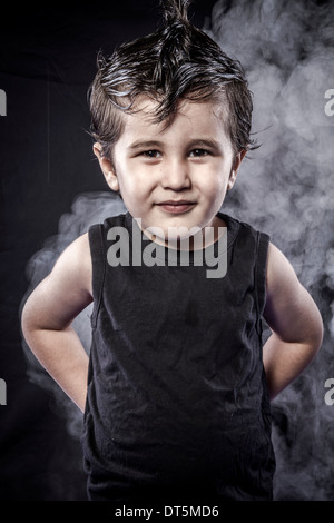 Portrait child rocker dress and funny expressions crested Stock Photo