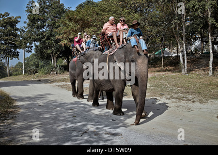 Tourists and mahout elephant trekking in Thailand tourism S. E. Asia Stock Photo