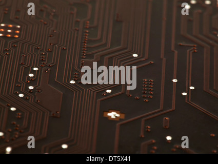 Laptop motherboard dark brown circuit background Stock Photo