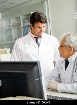Technicians Discussing In Laboratory Stock Photo