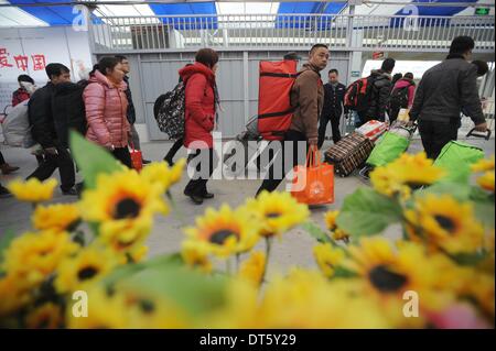Chengdu, China's Sichuan Province. 10th Feb, 2014. Passengers prepare to take the train at the waiting room in Chengdu Railway Station in Chengdu, capital of southwest China's Sichuan Province, Feb. 10, 2014. With the Spring Festival coming to an end, people started to leave their hometowns for the workplaces. © Xue Yubin/Xinhua/Alamy Live News Stock Photo