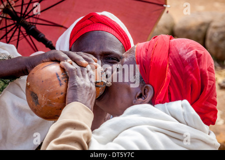 Dorze Women Drinking Local Beer Together At The Thursday Market In The Dorze Village Of Hayto, near Arba Minch, Ethiopia Stock Photo