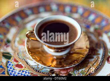 Turkish, greek coffee is a method of preparing coffee. Roasted and then finely ground coffee beans are boiled in a pot (cezve) Stock Photo