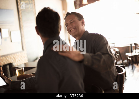 Two business partners in wine bar Stock Photo