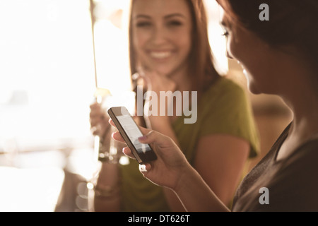 Businesswomen enjoying drinks in a wine bar Stock Photo