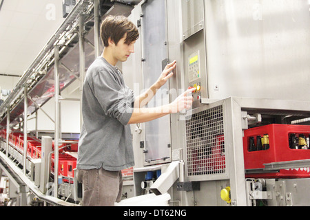 Man using control panel in brewery Stock Photo