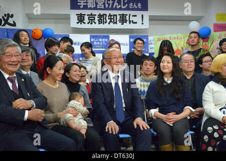 Tokyo Japan 9th Feb 14 Yoichi Masuzoe Accompanied By His Wife Masami Holds A Bouquet Of Flowers Given To Him For A Landslide Victory In Sunday S Gubernatorial Election As He Celebrates The