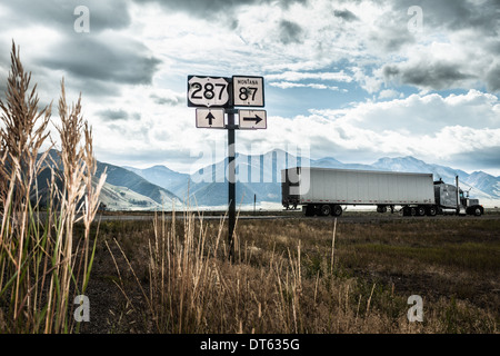 Truck on highway, Wyoming, USA Stock Photo