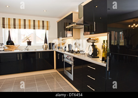 Modern black fitted kitchen Stock Photo