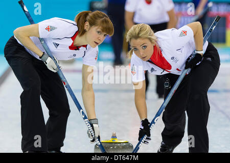 Sochi, Krasnodar Krai, Russia. 10th Feb, 2014. Great Britain's vice-skip Anna SLOAN (right) Claire HAMILTON (left) sweep during the Women's Curling round robin match between Great Britain and Sweden at the Ice Cube Curling Centre - XXII Olympic Winter Games © Action Plus Sports/Alamy Live News Credit:  Action Plus Sports/Alamy Live News Stock Photo