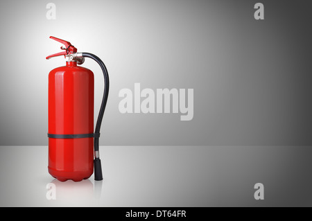 fire extinguisher on gray background Stock Photo