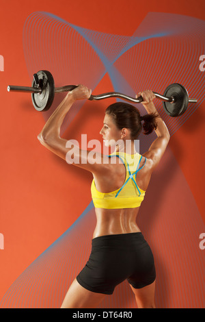 Weightlifter lifting barbells Stock Photo