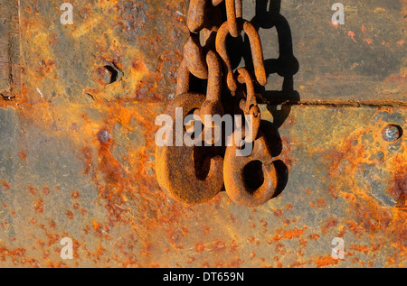 rusted chains and hooks on old rusty buoy, granville, normandy, france Stock Photo