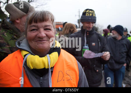 Barton Moss, Manchester, UK. 10th Feb, 2014.  Grandma Steel at Protests by anti-fracking campaigners and a policing operation by Greater Manchester Police continue at IGAS Drilling Site at Barton Moss. Protestors are seeking to delay and obstruct delivery vehicles and drilling equipment en-route to the controversial gas exploration site. Fracking protestors have set up a camp at Barton Moss Road, Eccles a potential methane-gas extraction site in Salford, Greater Manchester. Credit:  Mar Photographics/Alamy Live News. Stock Photo