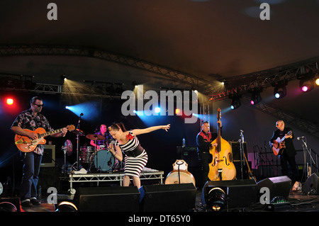 Music, Strings, Guitars, Irish Rockabilly singer Imelda May and her band performing at 2010 Cornbury Festival in Oxfordshire. Stock Photo