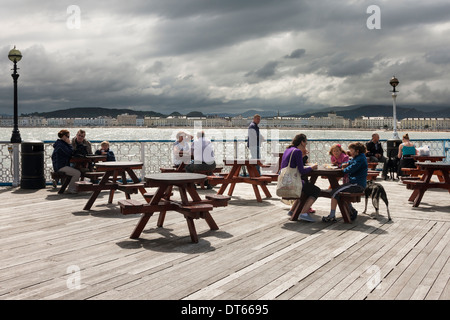 Tourists at cafe on Llandudno pier North Wales Stock Photo