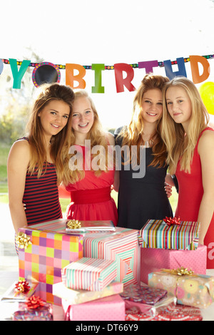 Teenage girl and friends with birthday gifts Stock Photo