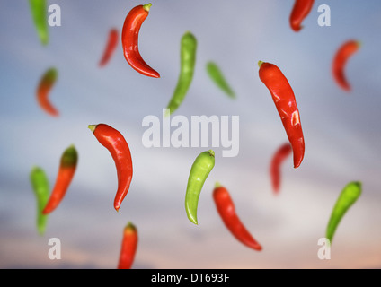 Composite still life of floating red and green chillies Stock Photo