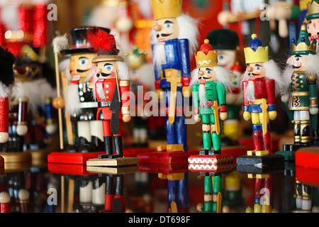 a large collection of various, colorful toy Christmas soldiers and Nutcrackers stand together Stock Photo
