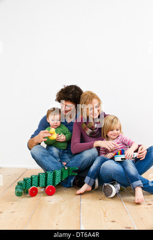 Studio shot of couple with two young daughters Stock Photo