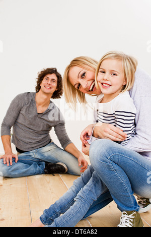 Studio shot of couple with daughter Stock Photo