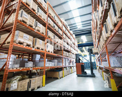 Forklift truck in parts store in factory