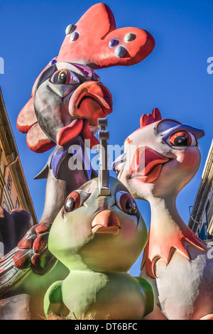 Spain, Valencia Province, Valencia, Papier Mache figures of chickens in the street during Las Fallas festival. Stock Photo