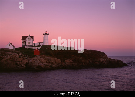 Cape Neddick and the Nubble Lighthouse, on a headland on the Maine coastline at sunset. Stock Photo