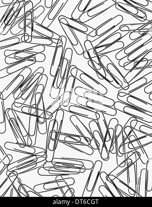 A large group of metal paperclips on a white background. Stock Photo