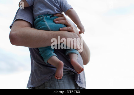 Father holding baby daughter Stock Photo