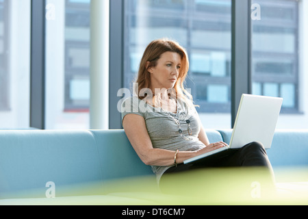 Businesswoman using laptop Stock Photo