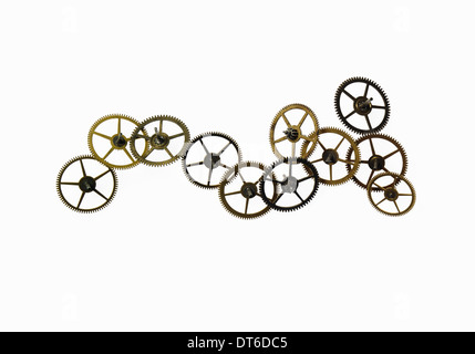 Watch gears, small precision made cog wheels with spokes and fine teeth or notches around the edge. The moving parts of a watch. Stock Photo